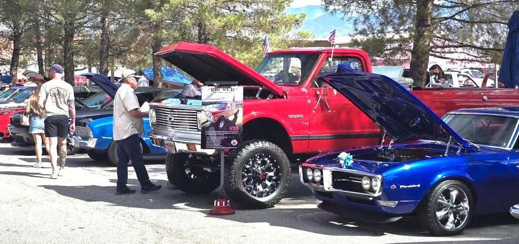 Pahrump Fall Festival Parade & Car Show - image of car show cars with  hoods raised.