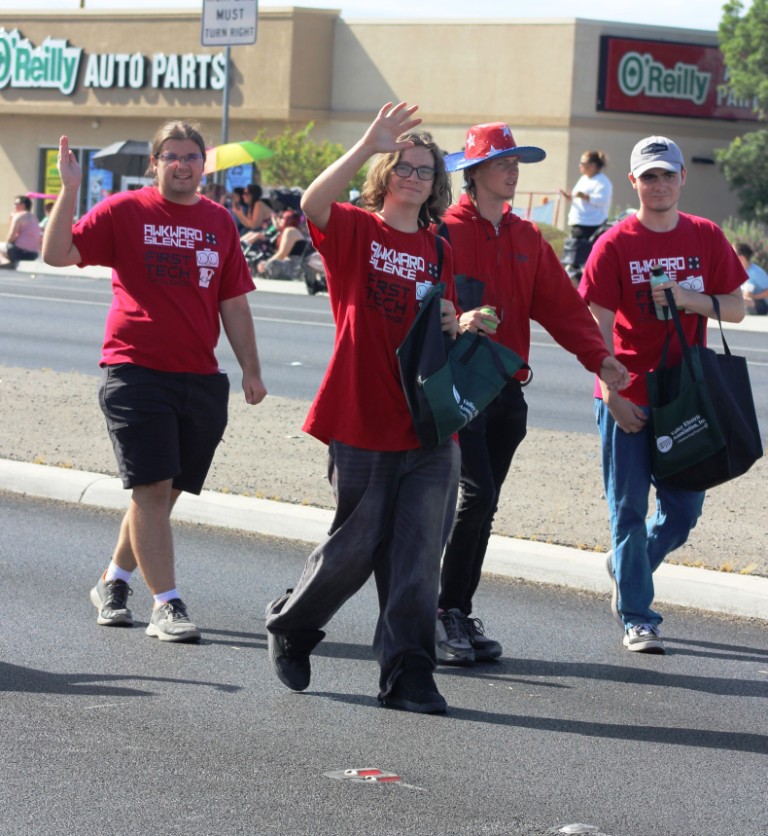 Pahrump Fall Festival Parade & Car Show - image of First Tech mascot and followers.