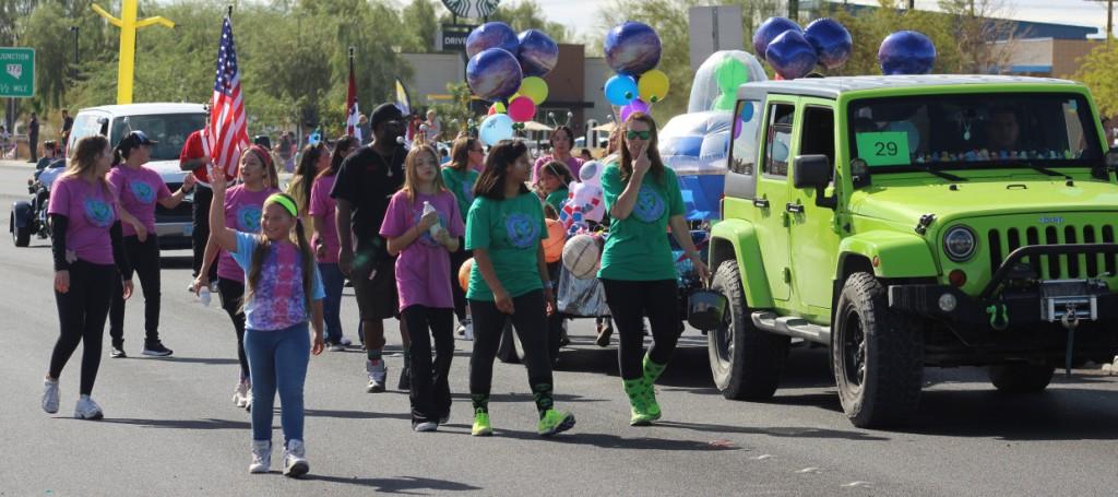 Pahrump Fall Festival Parade & Car Show - image of Healthcare (no name) float and followers.