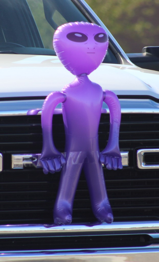 Pahrump Fall Festival Parade & Car Show - image of an inflatable purple alien riding a bumper. 