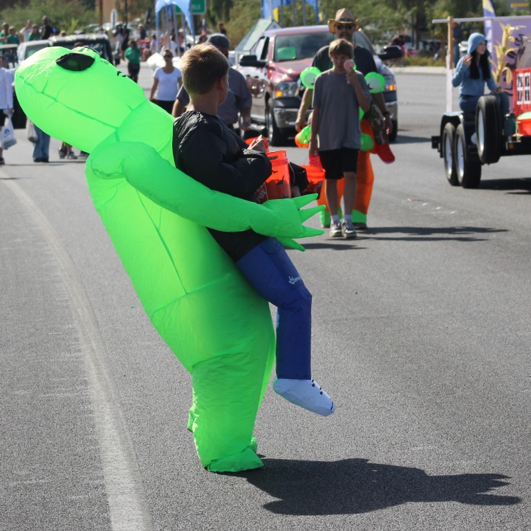 Pahrump Fall Festival Parade & Car Show - image of boy wearing an inflatable alien.