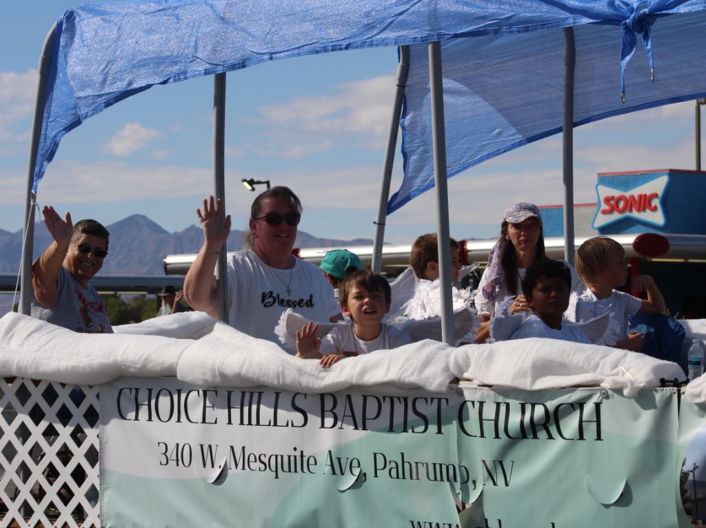 Pahrump Fall Festival Parade & Car Show - image of Choice Hills Baptist Church float and followers.