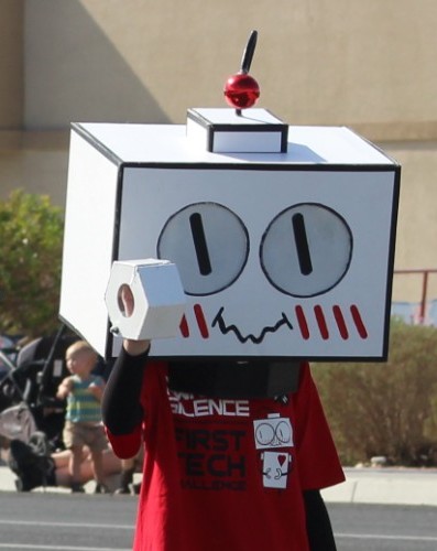 Pahrump Fall Festival Parade & Car Show - image of First Tech mascot and followers.