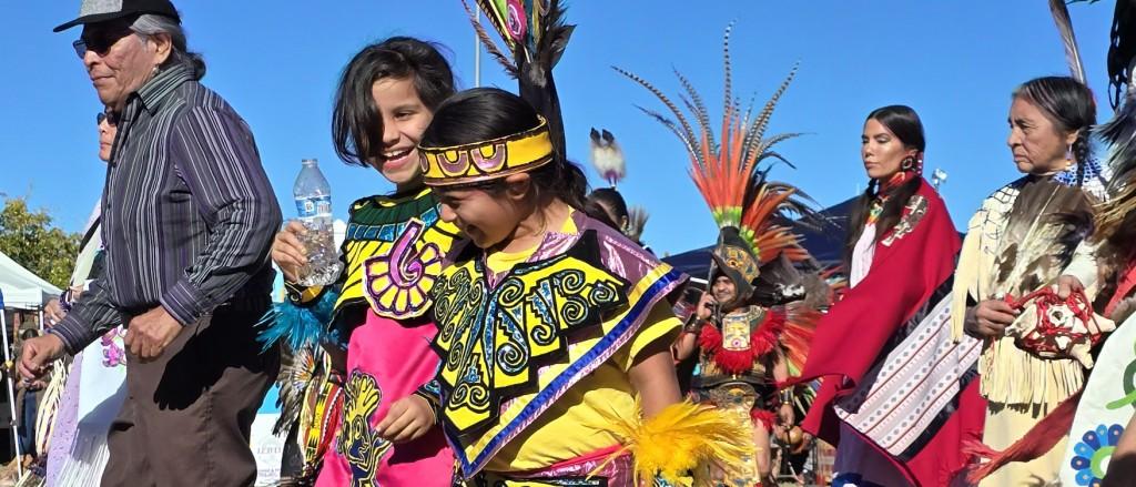 Pahrump Social Powwow 2025:  A colorful photo of children enjoying themselves during the Grand Entry circle walk.