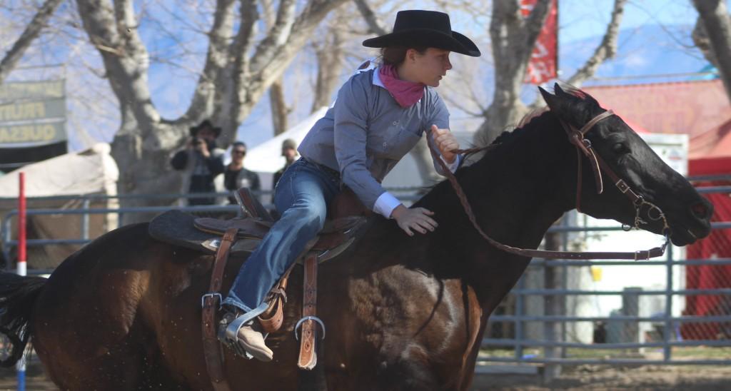 poll-bending event, rider dressed only in collared shirt and bandanna completes time trial in frigid cold at McCullough Arena, Pahrump NV, as seen in: rodeo Elko HS, rodeo, rodeo Eureka HS, rodeo Fernley HS, and rodeo Pahrump.