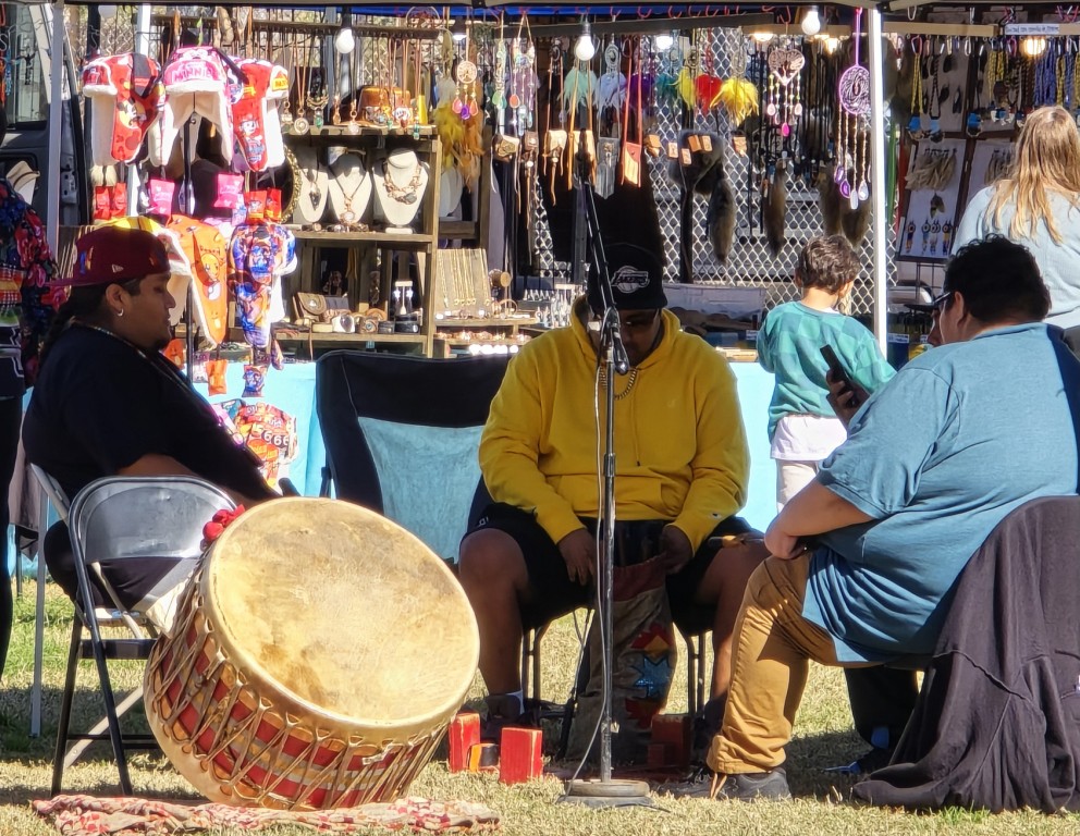 The drum crew, the Phoenix Boys, rests before they are called upon for the Grand Entry as seen in powwows: Cedar Band; Cedar City; Duck Valley; Elko; Ely; Fallon; Fort Mojave; Goshute; Las Vegas; Snow Mountain; Las Vegas Snow Mountain; Las Vegas Paiute Tribe; Las Vegas Snow Mountain Paiute; Las Vegas Snow Mountain Paiute Tribe; 33rd annual Las Vegas Snow Mountain Paiute; Moapa; Muckleshoot; Nevada Day; Numaga; Pahrump; Pahrump Valley; Pahrump Valley Social; Pahrump Social; Petrack; Petrack Park; Red Dress; Sacred Visions; San Marcos; San Marcos Apache; Stewart; Sycuan; UNLV; UNR; Univ. of Nev. Reno; and Walker River; & Western Navajo Fair.