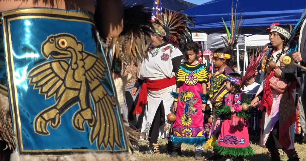 Pahrump Social Powwow 2025: A colorful photo of children from the Gourde troop standing at attention for prayer after the Grand Entry stops.