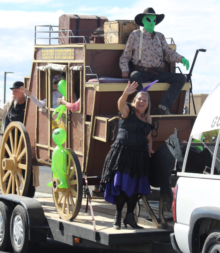 Pahrump gunfighters in a stagecoach float in Pahrump Fall Festival Parade.