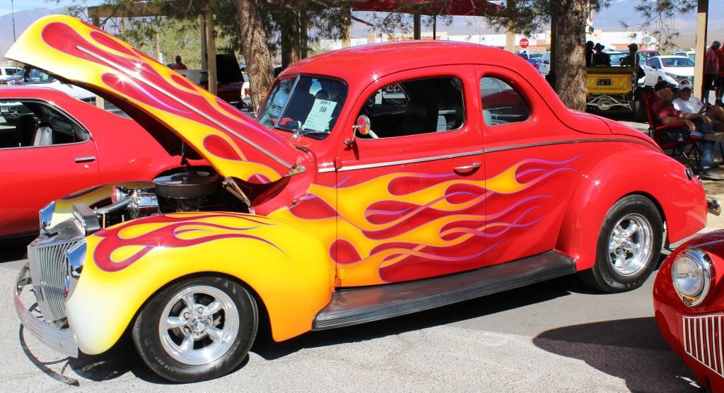 2026 Pahrump Fall Festival Parade & Car Show circa 1940's red chromed coupe with flame fenders.