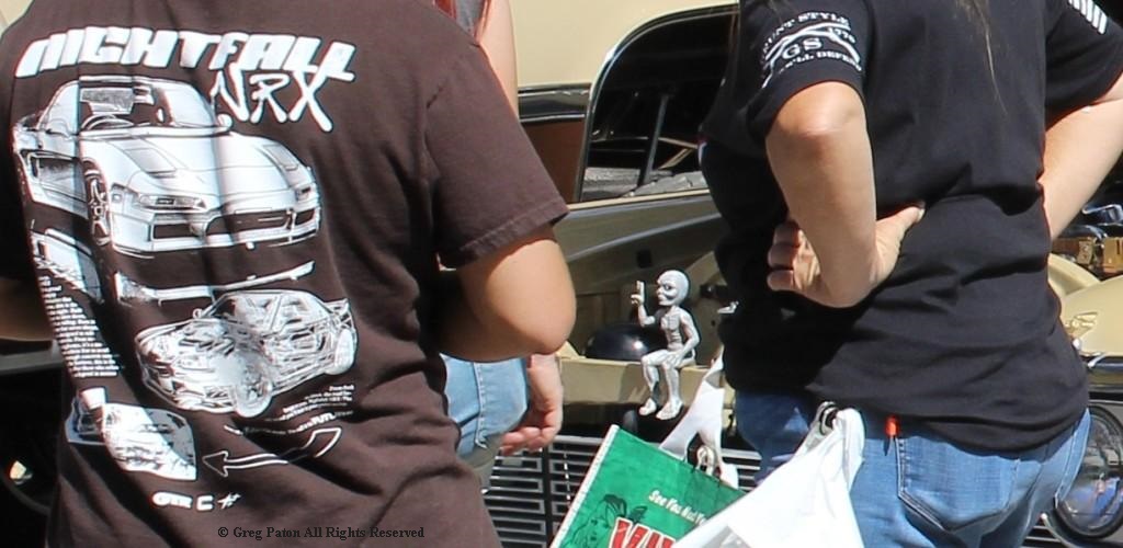 2026 Pahrump Fall Festival Parade & Car Show as two car buffs eye the Pontiac Imperial engine bay.